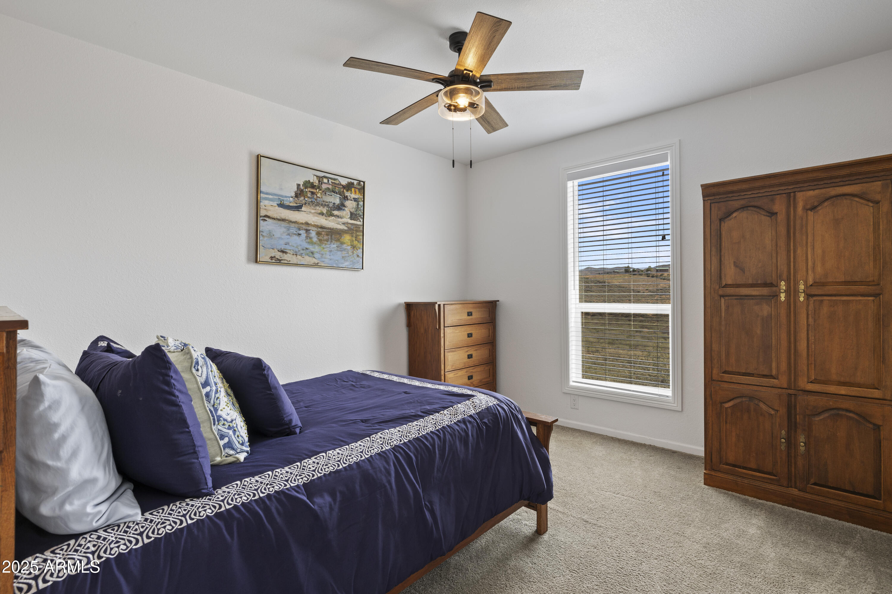 1235 North Harvest Road Dewey, AZ 86327 - Photo 17 of 37 a bedroom with furniture and a window