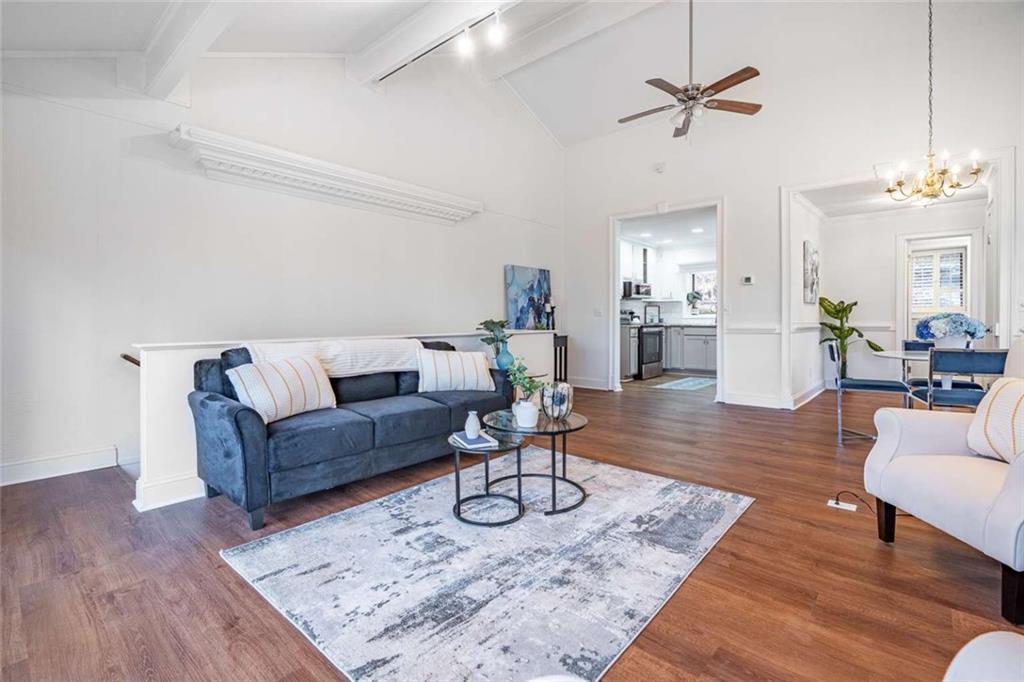 200 Villa Road, Unit 126 Jasper, GA 30143 - Photo 17 of 38 a living room with furniture and a chandelier