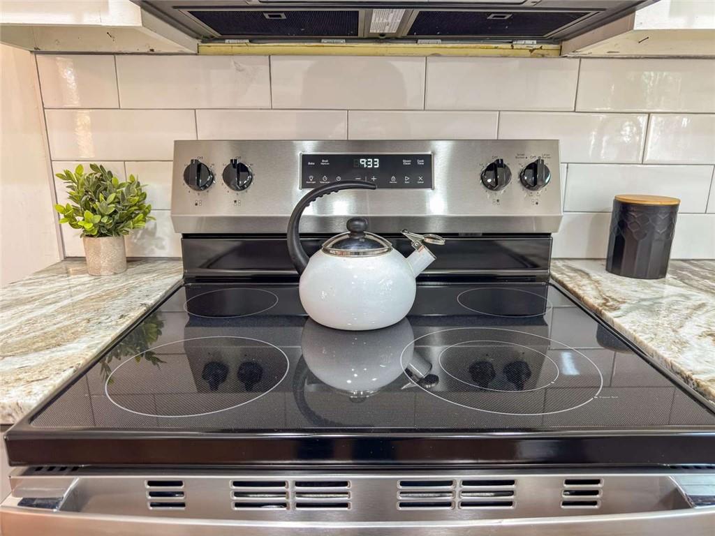 200 Villa Road, Unit 126 Jasper, GA 30143 - Photo 23 of 38 a kitchen with a stove and cabinets