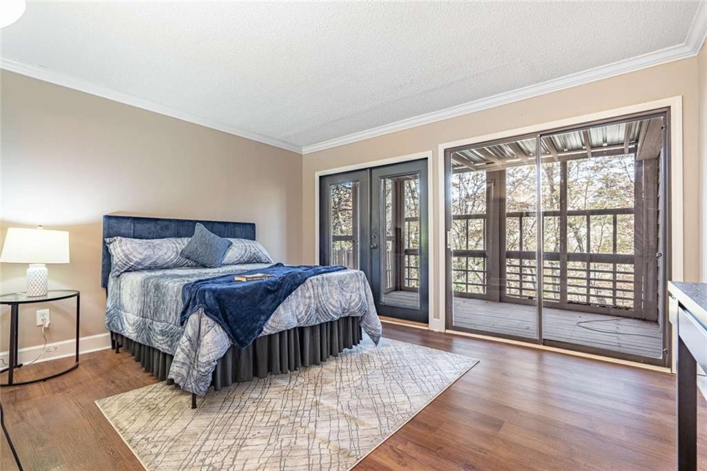 200 Villa Road, Unit 126 Jasper, GA 30143 - Photo 28 of 38 a bedroom with a large bed and a large window