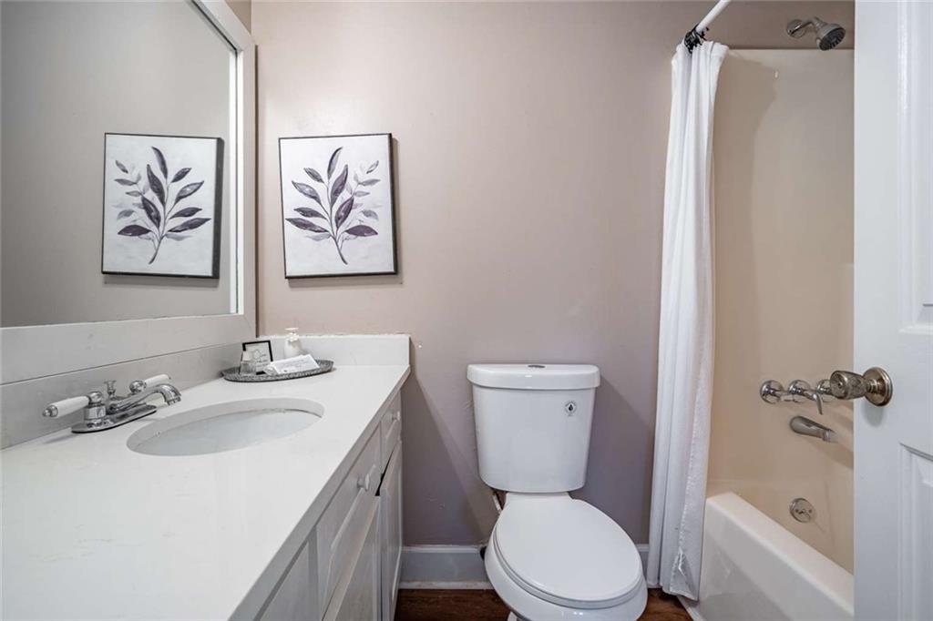 200 Villa Road, Unit 126 Jasper, GA 30143 - Photo 30 of 38 a bathroom with a toilet sink and mirror