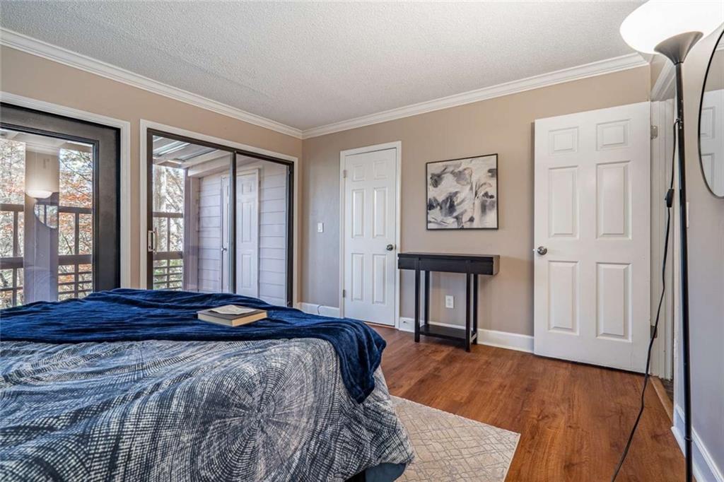 200 Villa Road, Unit 126 Jasper, GA 30143 - Photo 31 of 38 a bedroom with a bed and a large window