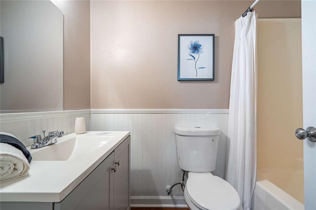 200 Villa Road, Unit 126 Jasper, GA 30143 - Photo 35 of 38 a bathroom with a toilet sink and mirror