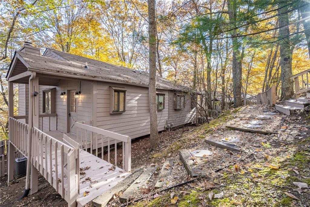 200 Villa Road, Unit 126 Jasper, GA 30143 - Photo 6 of 38 a view of a house with backyard and trees