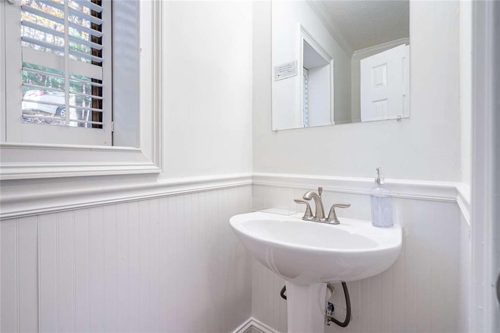 200 Villa Road, Unit 126 Jasper, GA 30143 - Photo 8 of 38 a bathroom with a sink and a mirror