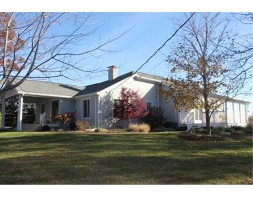 Exterior Front. Gorgeous 4 bedroom 2 1/2 bath home sits on 3.6 acres of professionally landscaped ground with a waterfall and pond