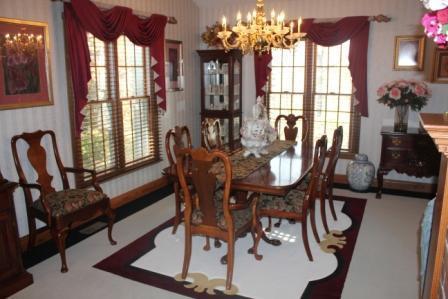 Dining Room. Dining Room has large windows, beautiful chandelair,and built-in cabinetry.