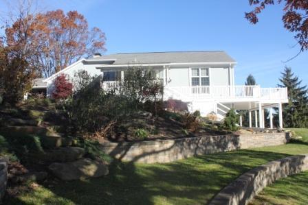 64 Devils Den Road Burgettstown, PA 15021 - Photo 12 of 18 Exterior Back. Stone walls in Garden with pond and waterfall