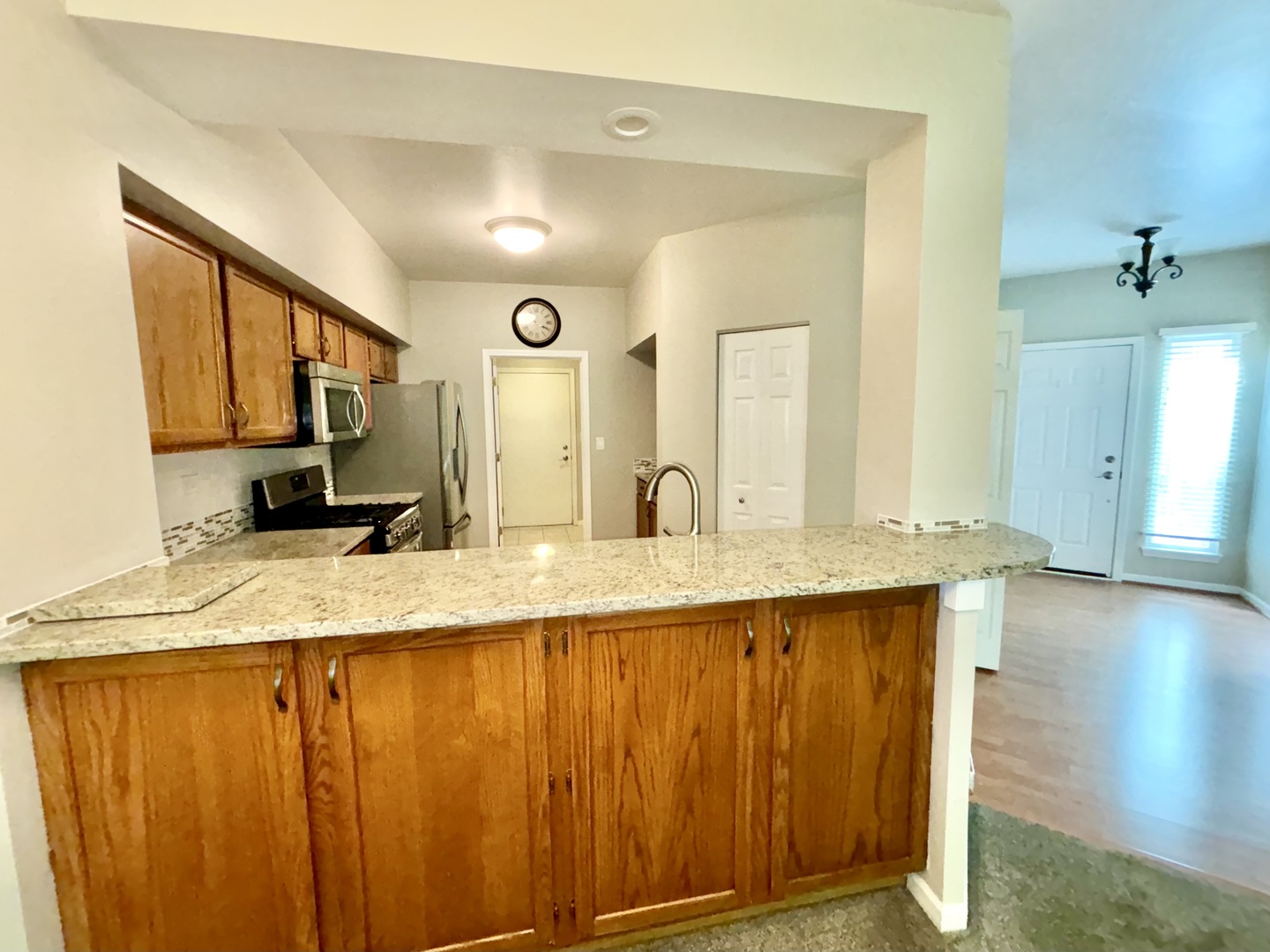8241 Ripple Ridge Darien, IL 60561 - Photo 5 of 24 a bathroom with a granite countertop sink and a mirror