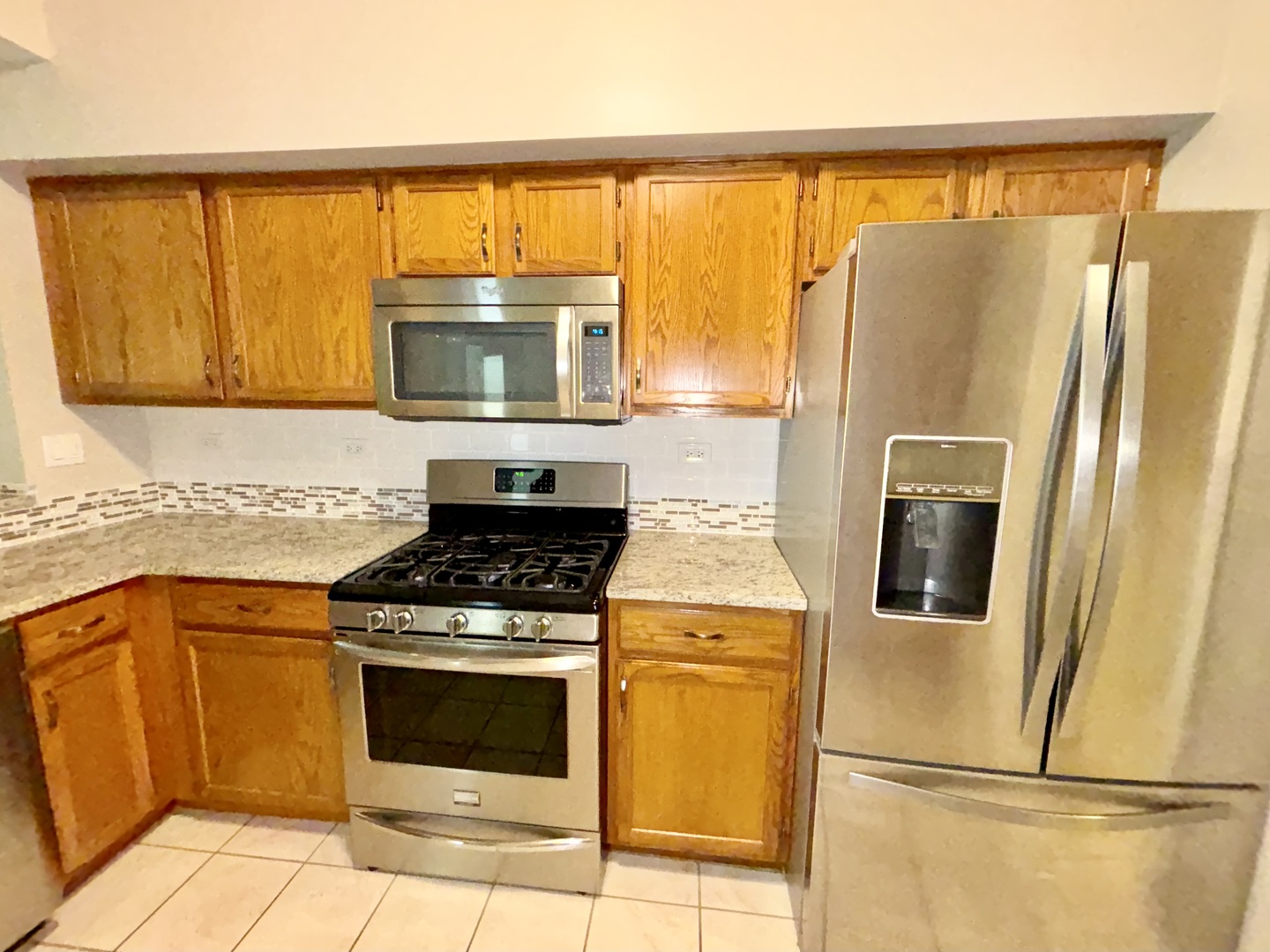 8241 Ripple Ridge Darien, IL 60561 - Photo 6 of 24 a kitchen with a stove top oven and a refrigerator