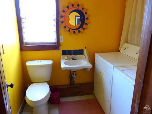 a bathroom with a toilet and a sink