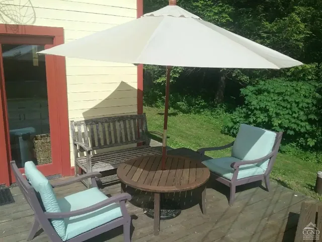 a view of a patio with furniture