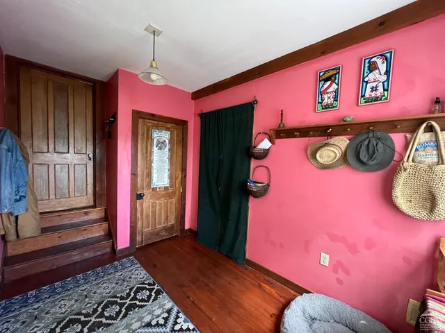 a bedroom with furniture and a window