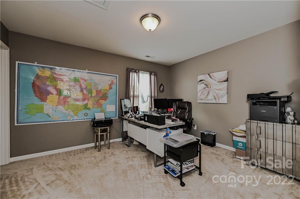10311 Atkins Ridge Drive Charlotte, NC 28213 - Photo 12 of 18 a living room with furniture and a flat screen tv