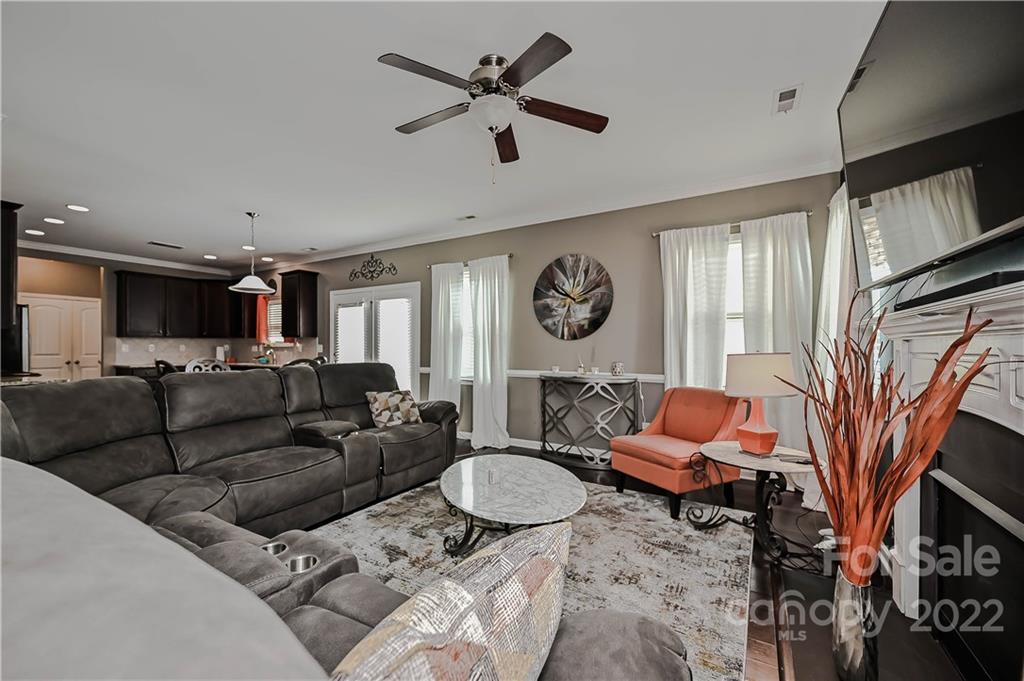 10311 Atkins Ridge Drive Charlotte, NC 28213 - Photo 7 of 18 a living room with furniture ceiling fan and a window