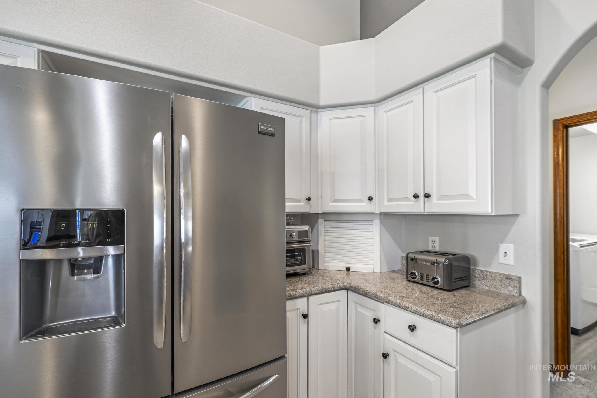 1558 Brookside Loop Twin Falls, ID 83301 - Photo 14 of 47 Stainless steel refrigerator with a built-in ice and water dispenser