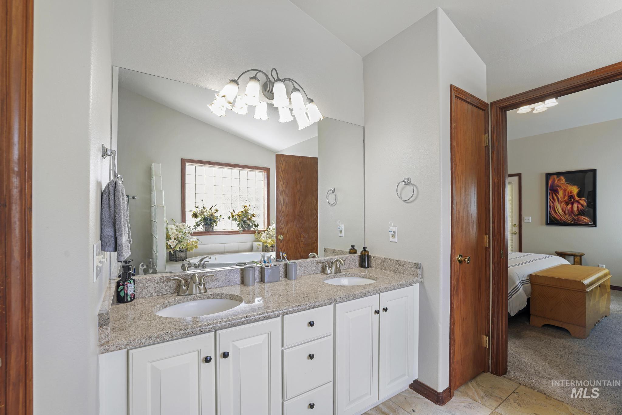 1558 Brookside Loop Twin Falls, ID 83301 - Photo 20 of 47 Dual vanity with granite-finish countertop and white cabinetry
