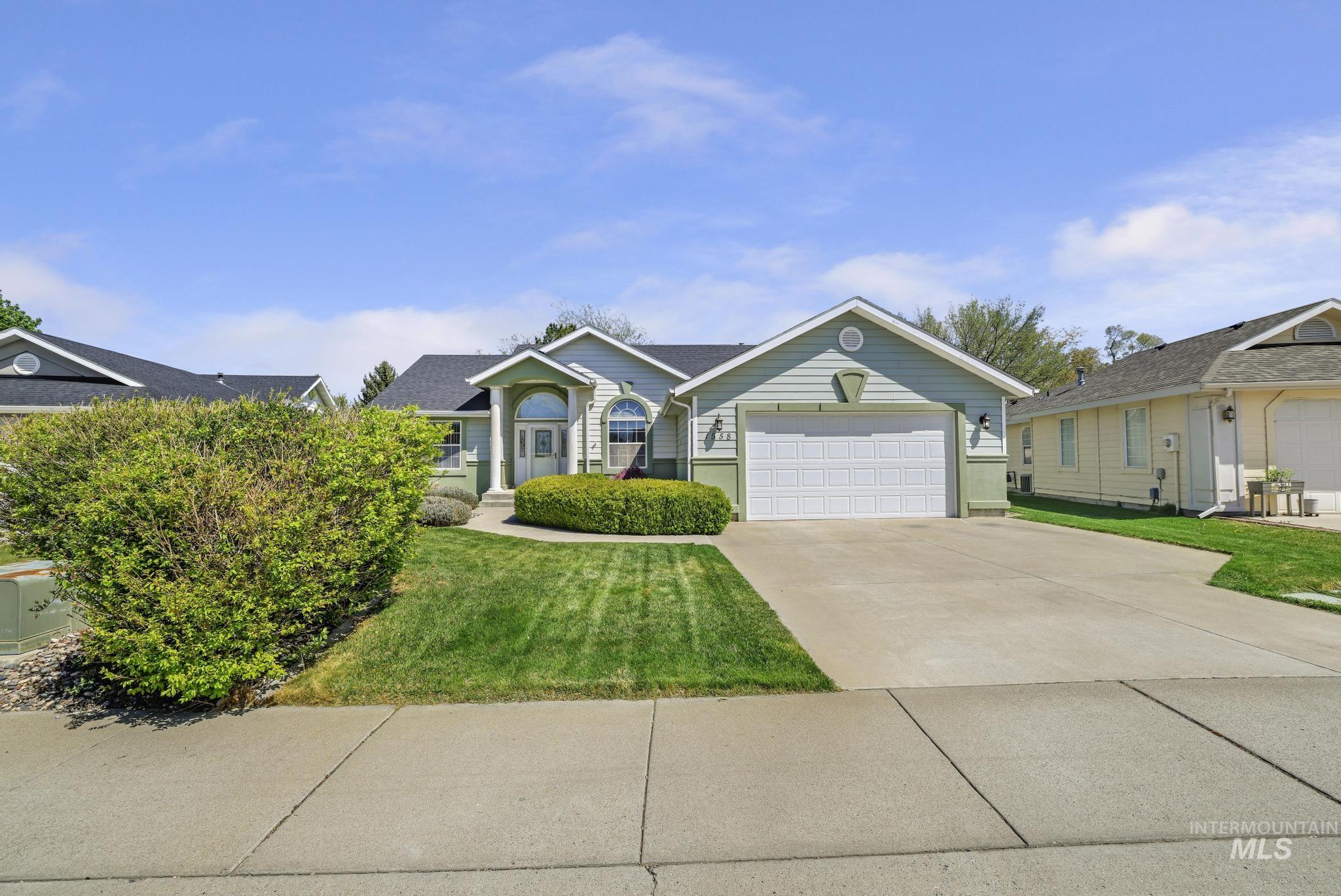 1558 Brookside Loop Twin Falls, ID 83301 - Photo 26 of 47 Single-story home featuring siding construction, a two-car garage, and a concrete driveway