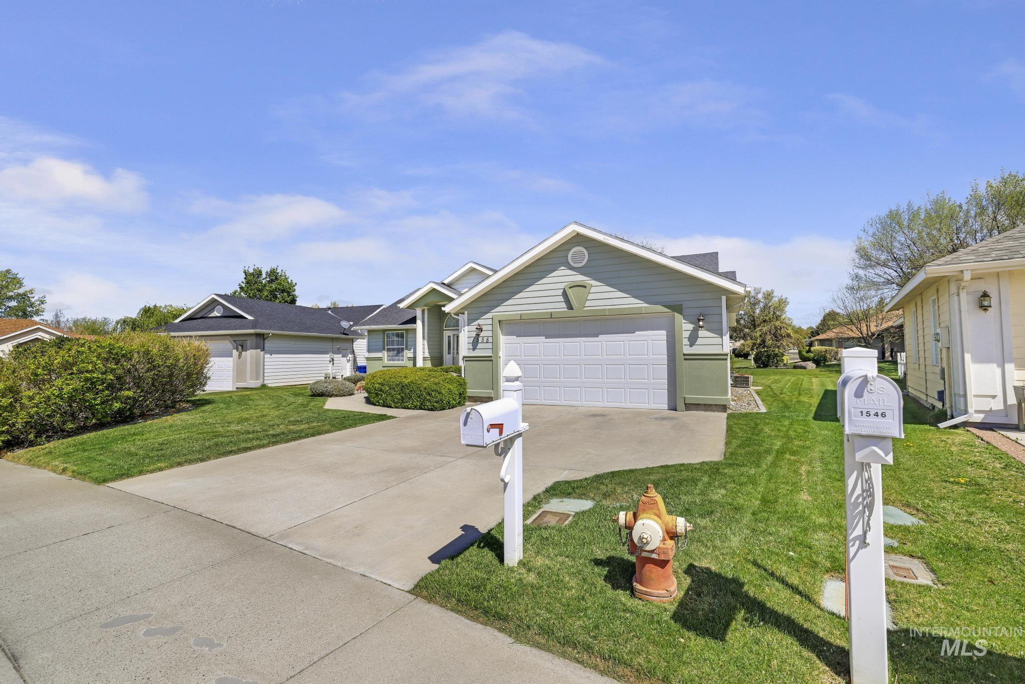1558 Brookside Loop Twin Falls, ID 83301 - Photo 27 of 47 Light green siding exterior with a prominent attached garage