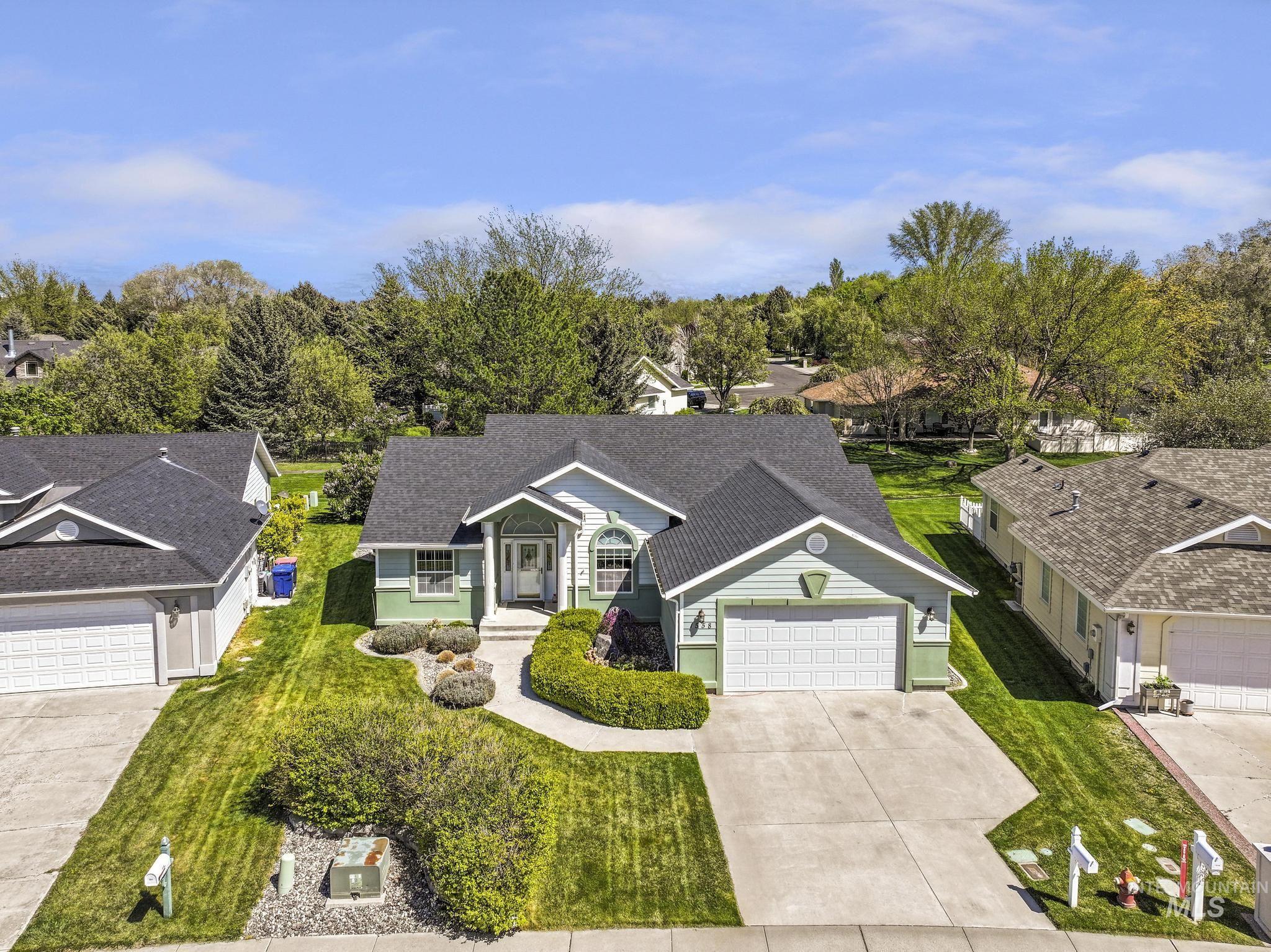 1558 Brookside Loop Twin Falls, ID 83301 - Photo 34 of 47 Light green siding exterior with dark shingle roofing