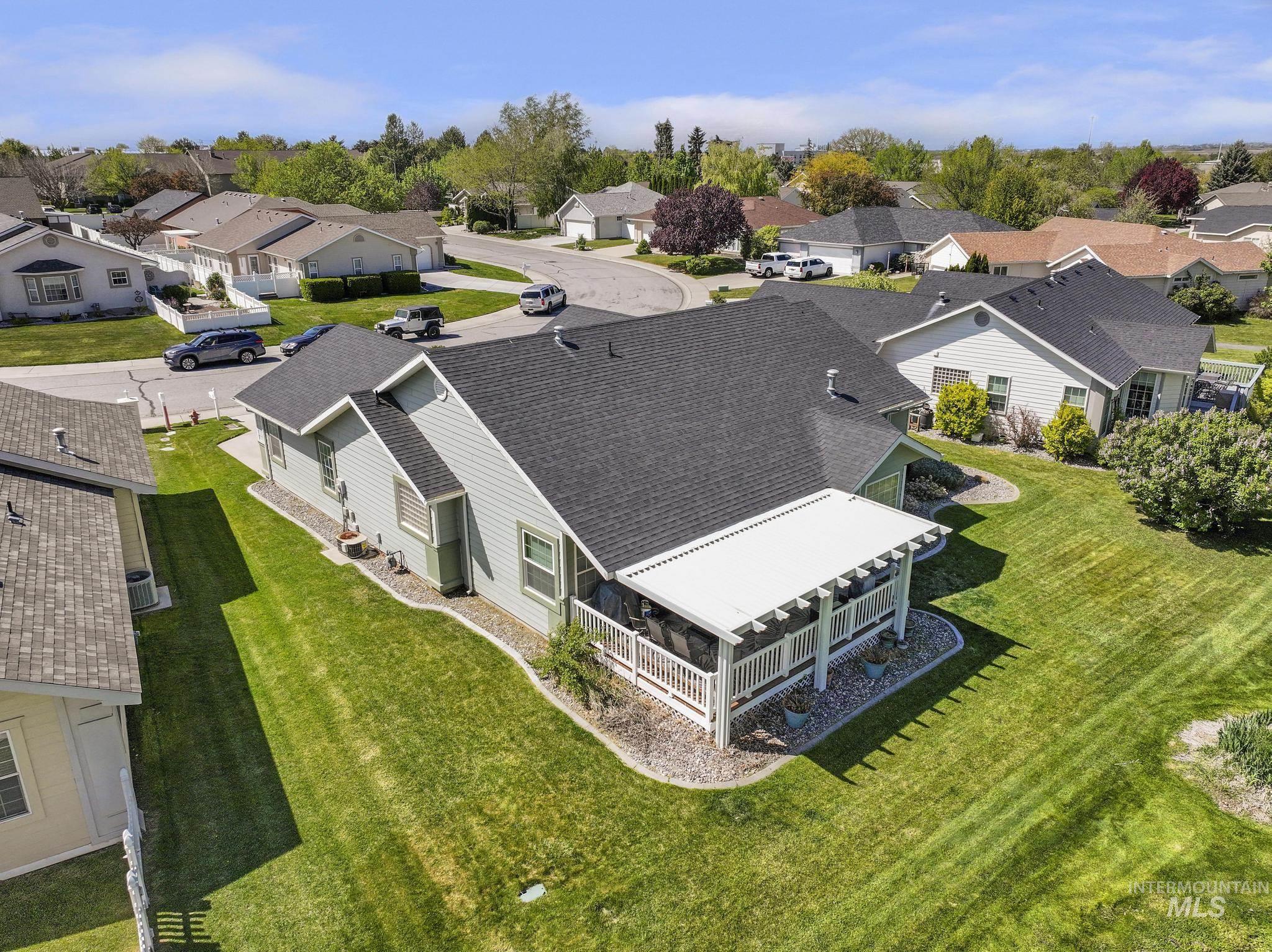 1558 Brookside Loop Twin Falls, ID 83301 - Photo 36 of 47 Single-story residence featuring a covered patio with white railing, a dark shingle roof, and light-colored siding