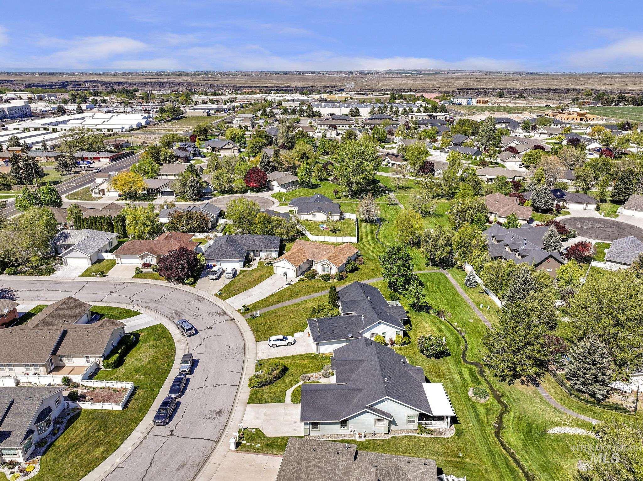 1558 Brookside Loop Twin Falls, ID 83301 - Photo 41 of 47 Aerial perspective of a residential neighborhood featuring single-story homes with varied rooflines and landscaping