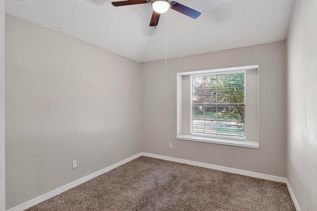820 Charter Oak Street Allen, TX 75002 - Photo 32 of 37 Carpeted empty room featuring a textured ceiling and a ceiling fan