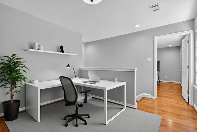 a bedroom with a bed and a ceiling fan