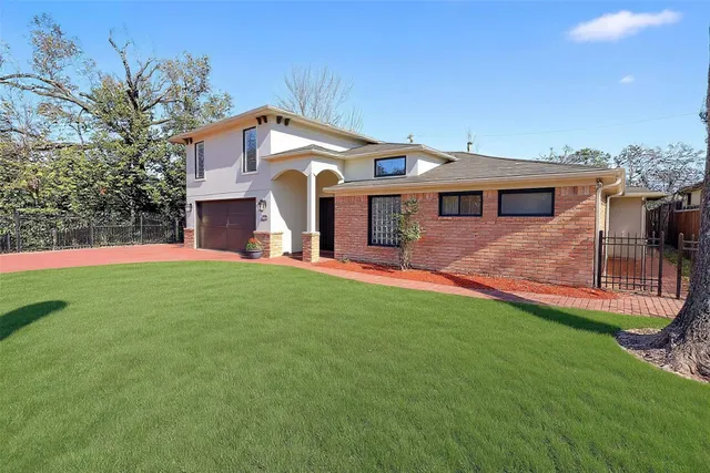 a front view of house with yard and outdoor seating