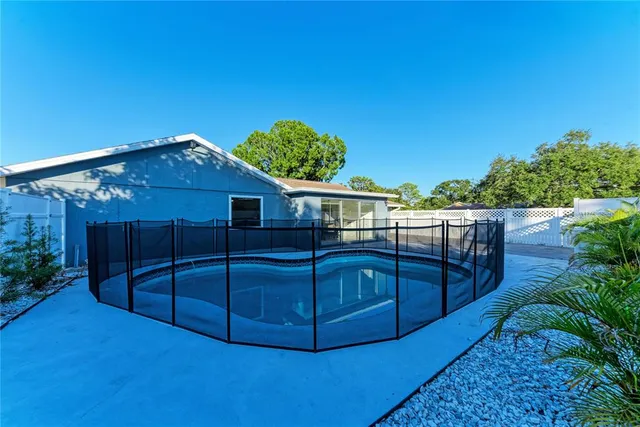 a view of a house with a backyard