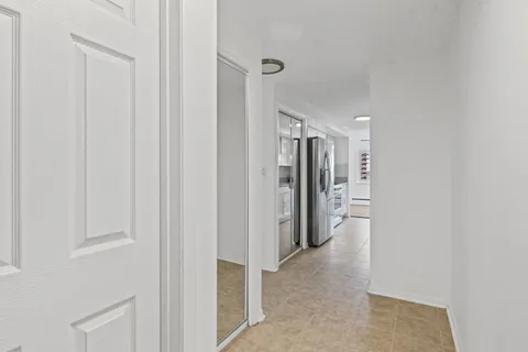 a kitchen with stainless steel appliances a refrigerator and a sink
