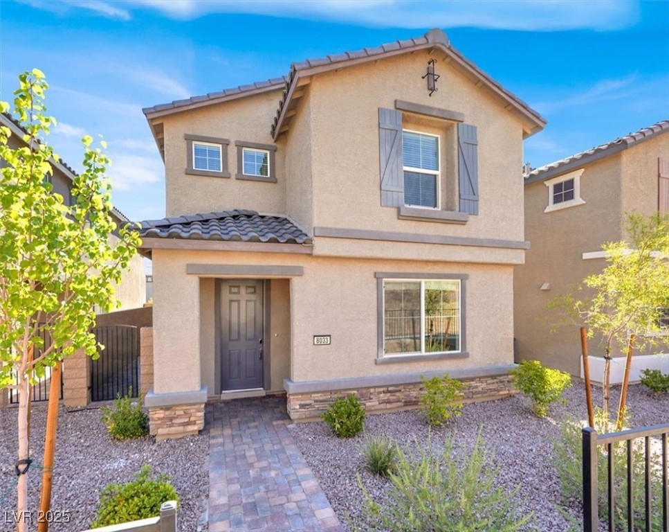 8033 Skye Foxx Street Las Vegas, NV 89166 - Photo 1 of 25 Mediterranean / spanish house featuring a tiled roof and stucco siding