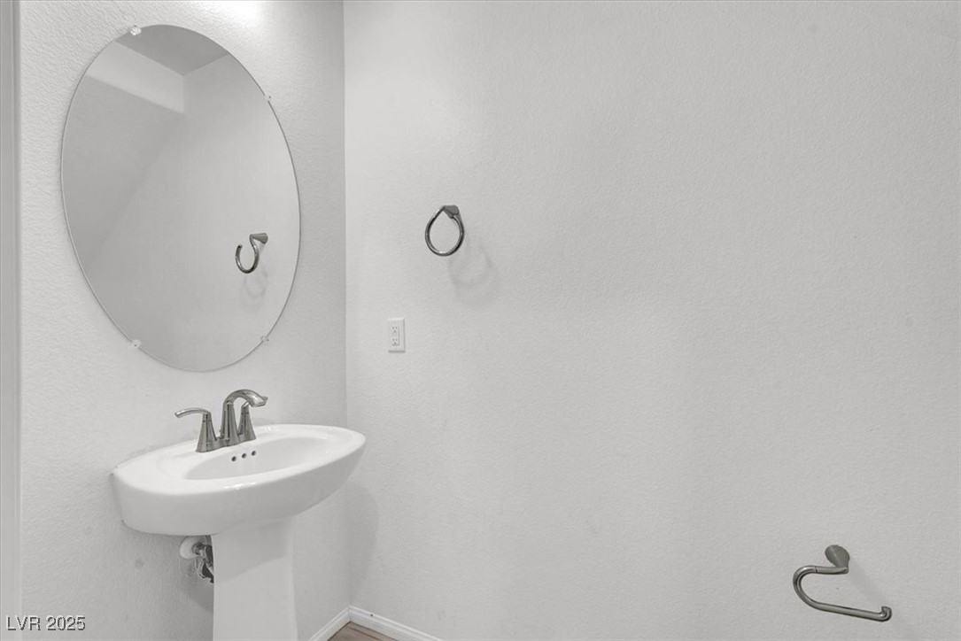 8033 Skye Foxx Street Las Vegas, NV 89166 - Photo 7 of 25 Bathroom with baseboards