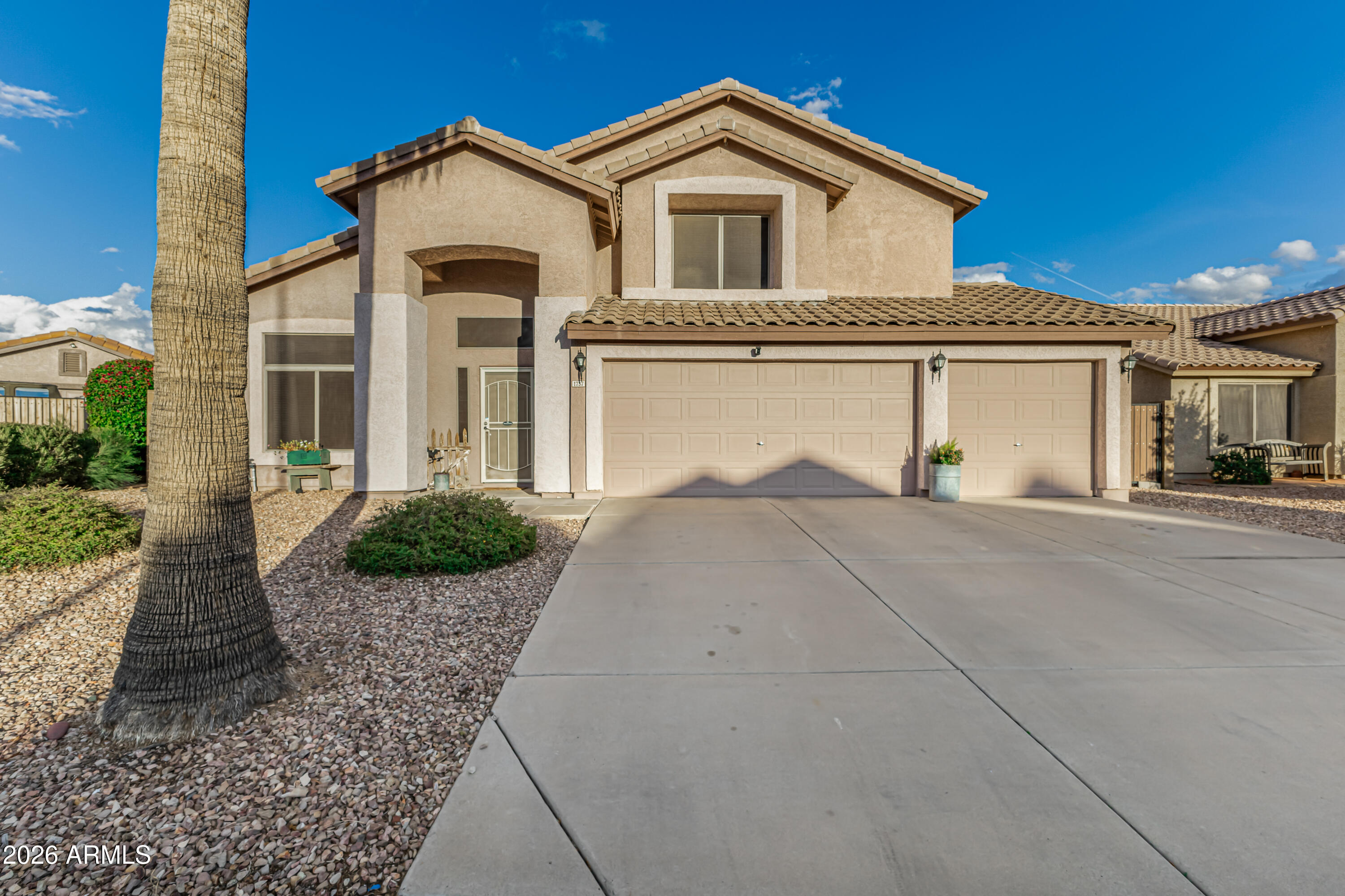 1737 South Talbot Mesa, AZ 85209 - Photo 1 of 35 a front view of a house with a yard