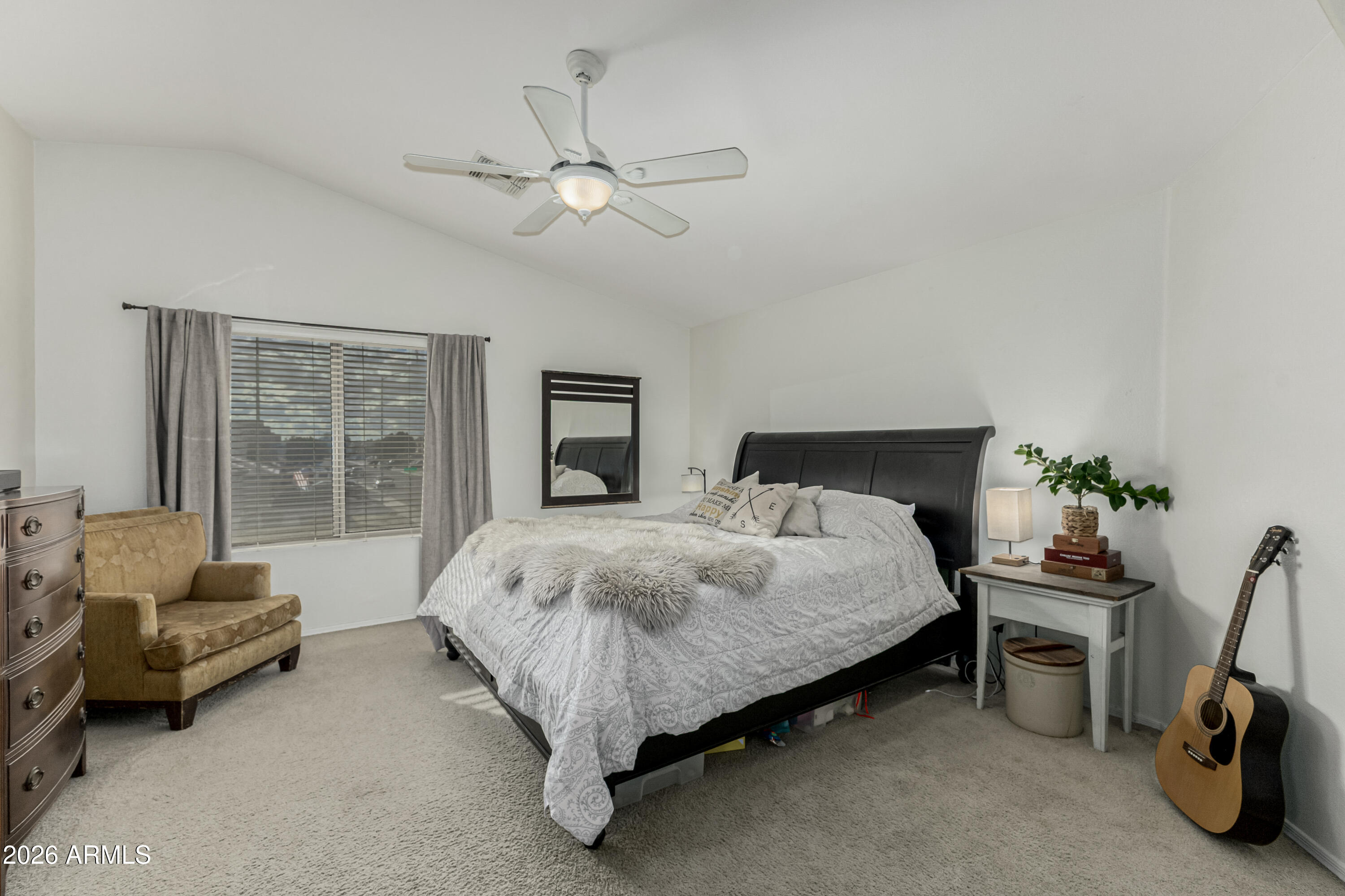 1737 South Talbot Mesa, AZ 85209 - Photo 21 of 35 a spacious bedroom with a bed a couch and a window