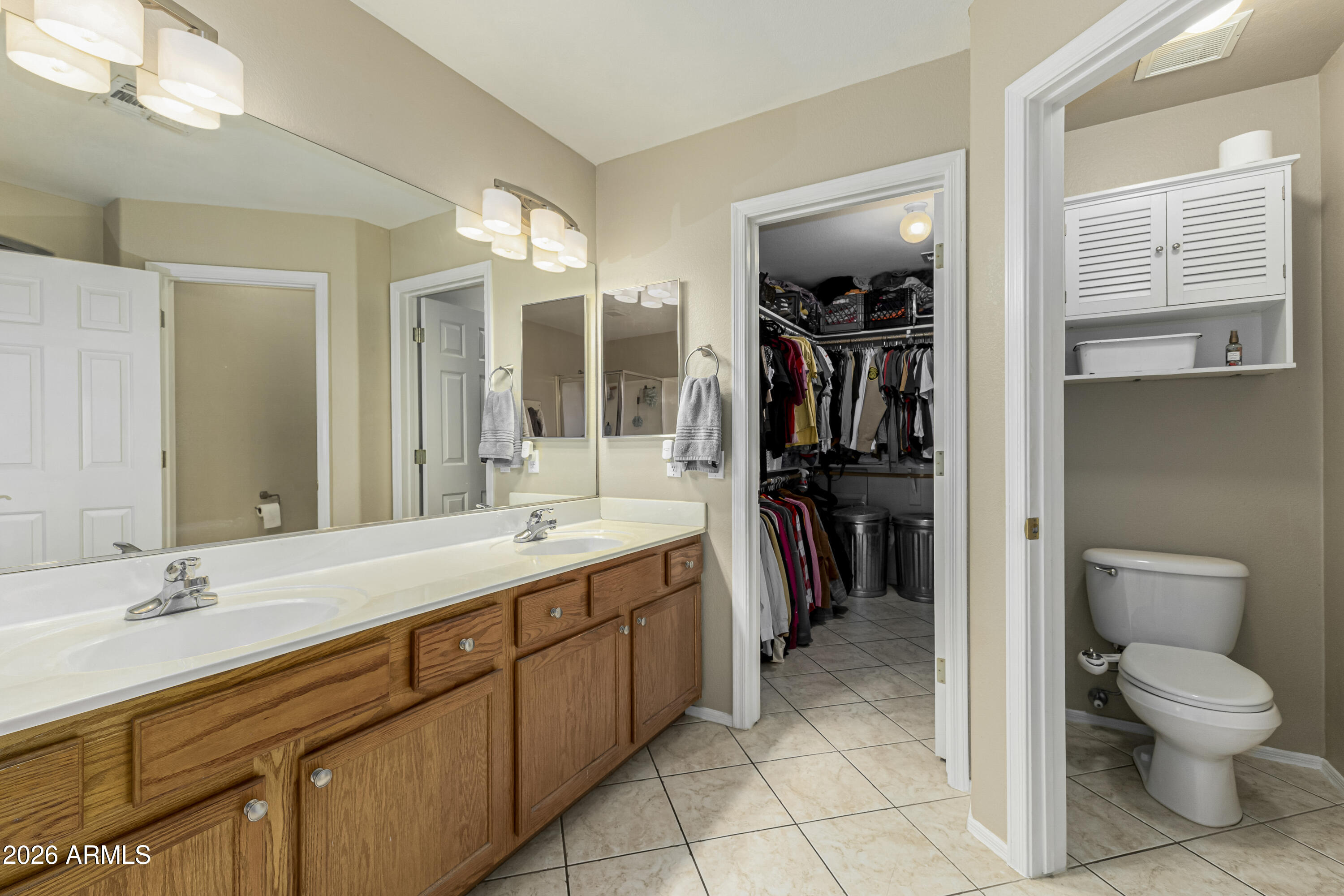 1737 South Talbot Mesa, AZ 85209 - Photo 22 of 35 a bathroom with a toilet a sink and a mirror