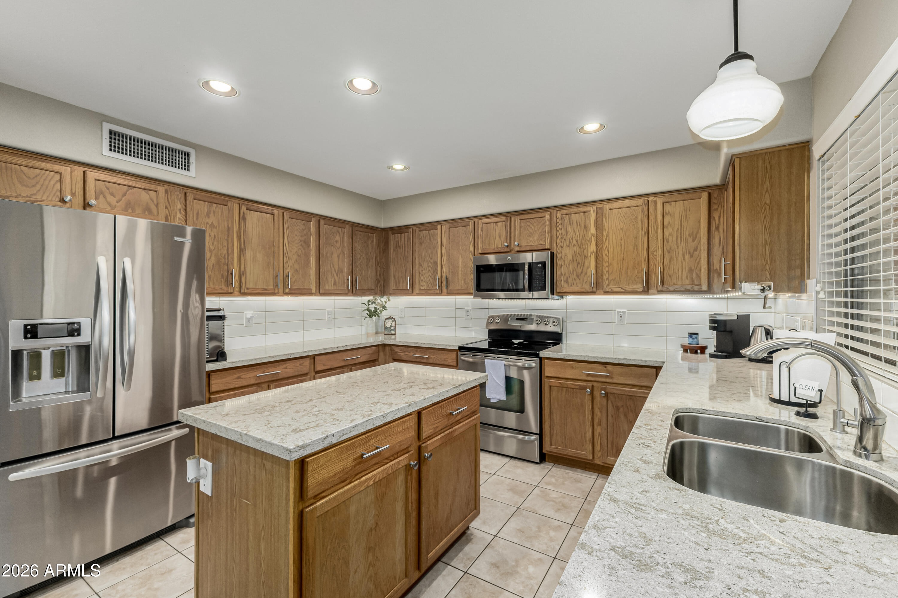 1737 South Talbot Mesa, AZ 85209 - Photo 2 of 35 a kitchen with a sink stove and refrigerator