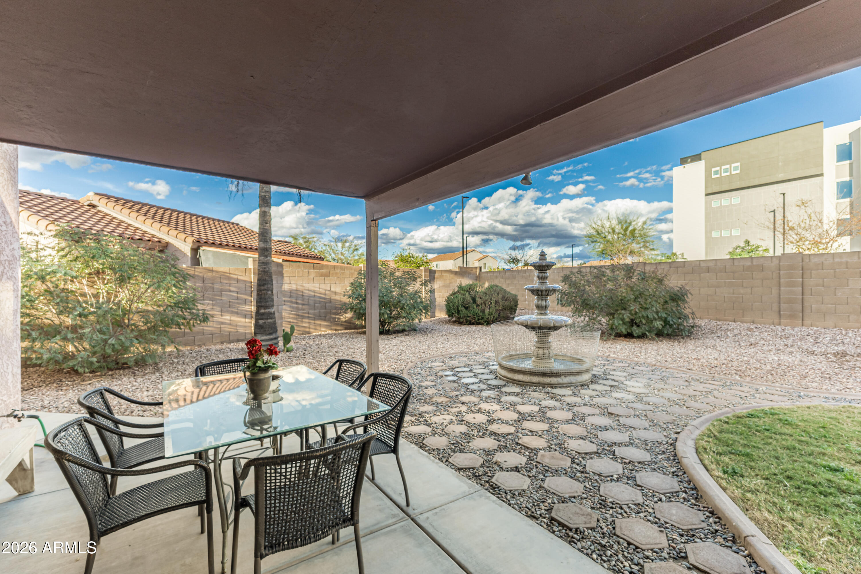 1737 South Talbot Mesa, AZ 85209 - Photo 28 of 35 a living room with patio furniture and a floor to ceiling window