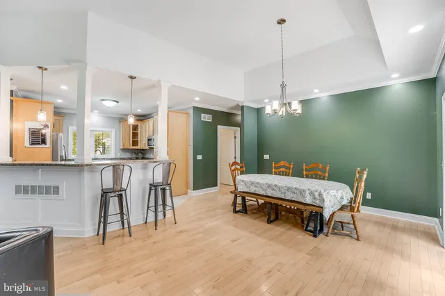 a room with pool table and windows