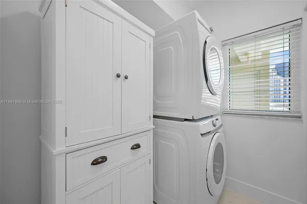 a close view of utility room with washer and dryer
