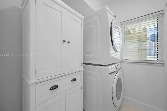 a close view of utility room with washer and dryer