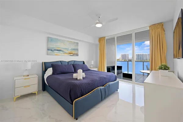 a bedroom with a bed and a couch