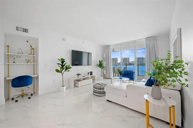 a living room with furniture and a potted plant