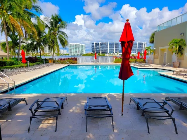 a view of swimming pool with outdoor seating