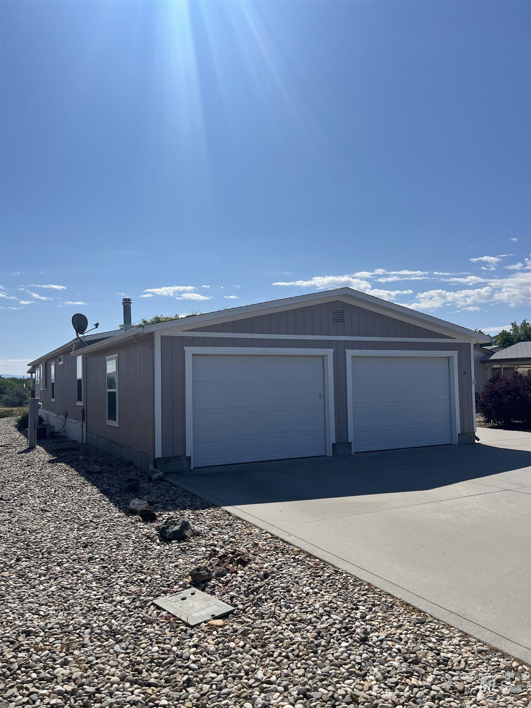 2750 Alden Road, Unit 34 Fruitland, ID 83619 - Photo 2 of 41 Garage featuring driveway