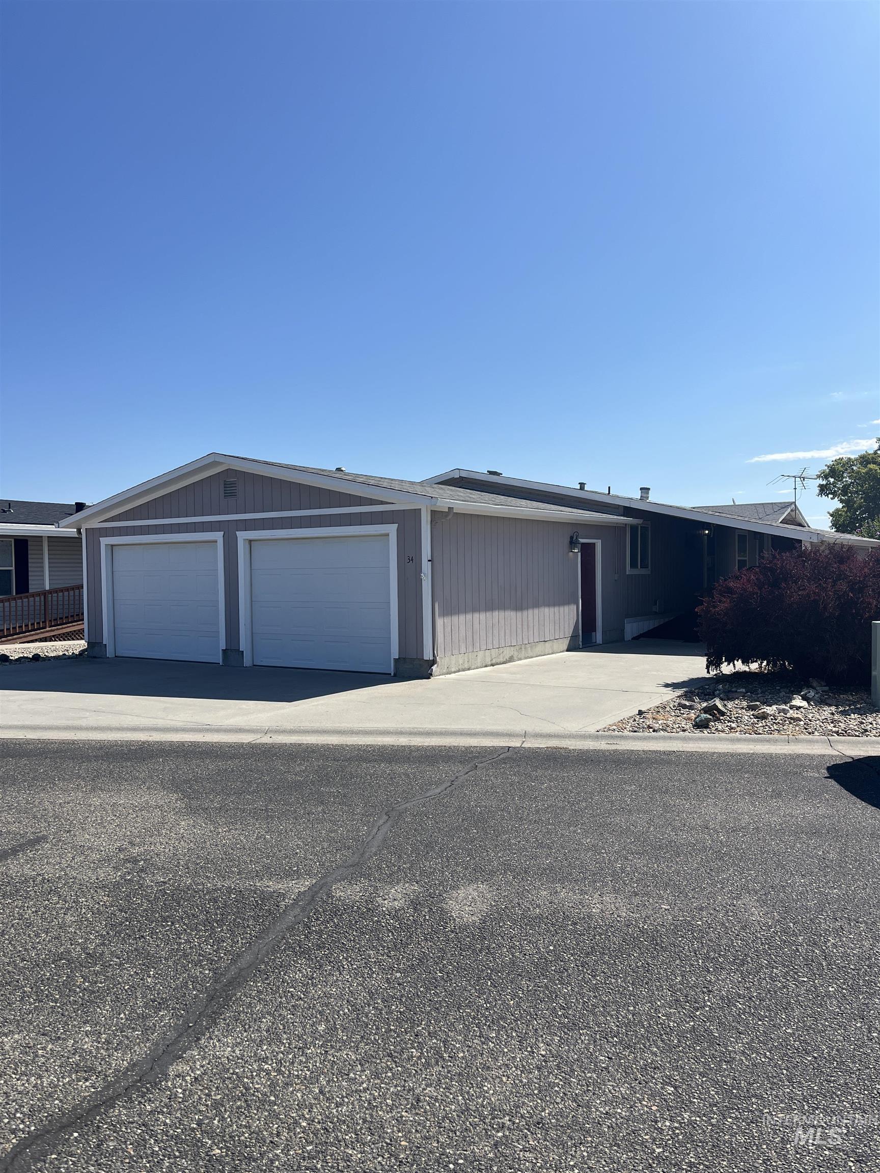 2750 Alden Road, Unit 34 Fruitland, ID 83619 - Photo 3 of 41 View of front of home featuring a garage