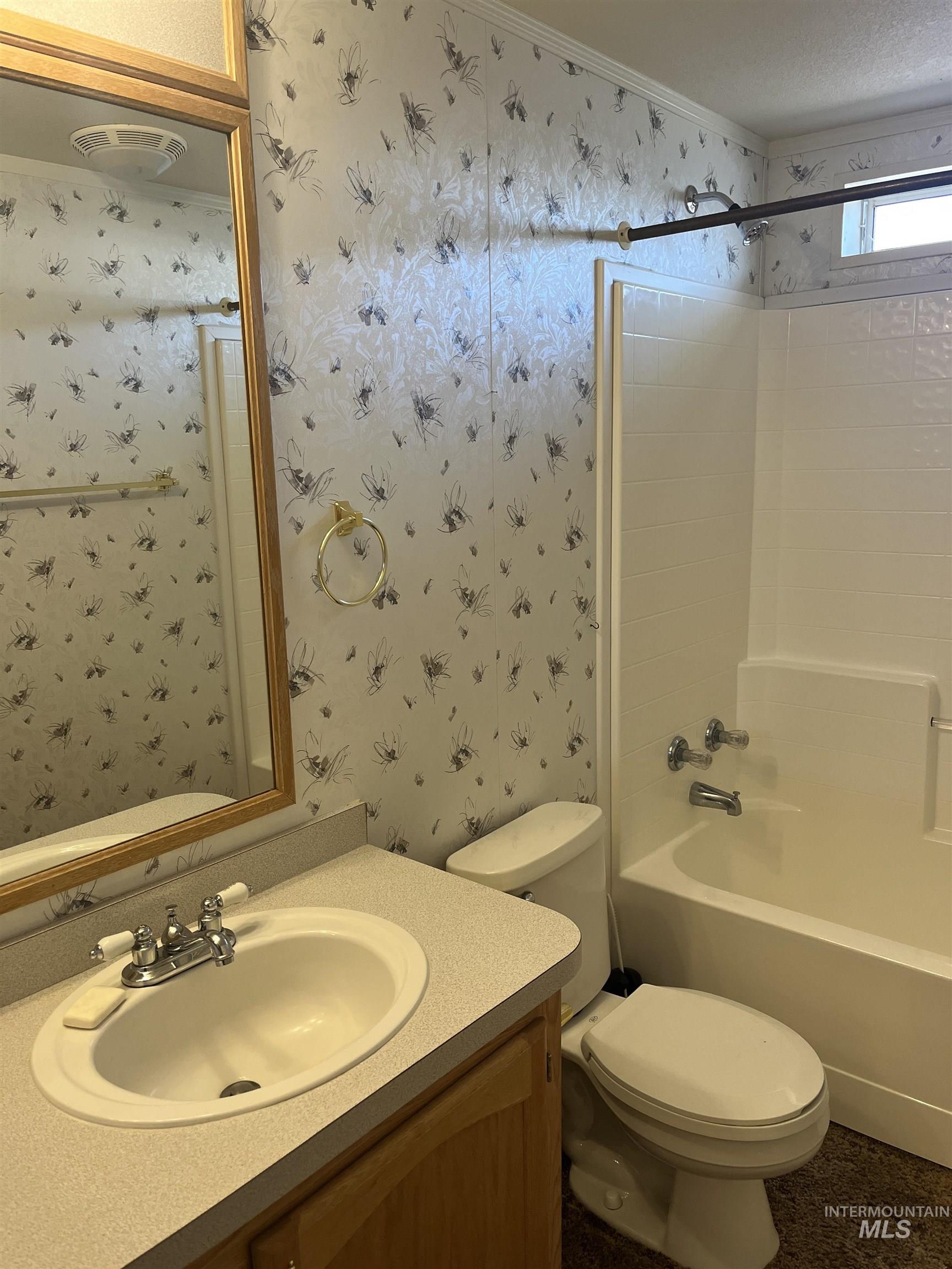 2750 Alden Road, Unit 34 Fruitland, ID 83619 - Photo 31 of 41 Bathroom featuring shower / bath combination, vanity, and wallpapered walls