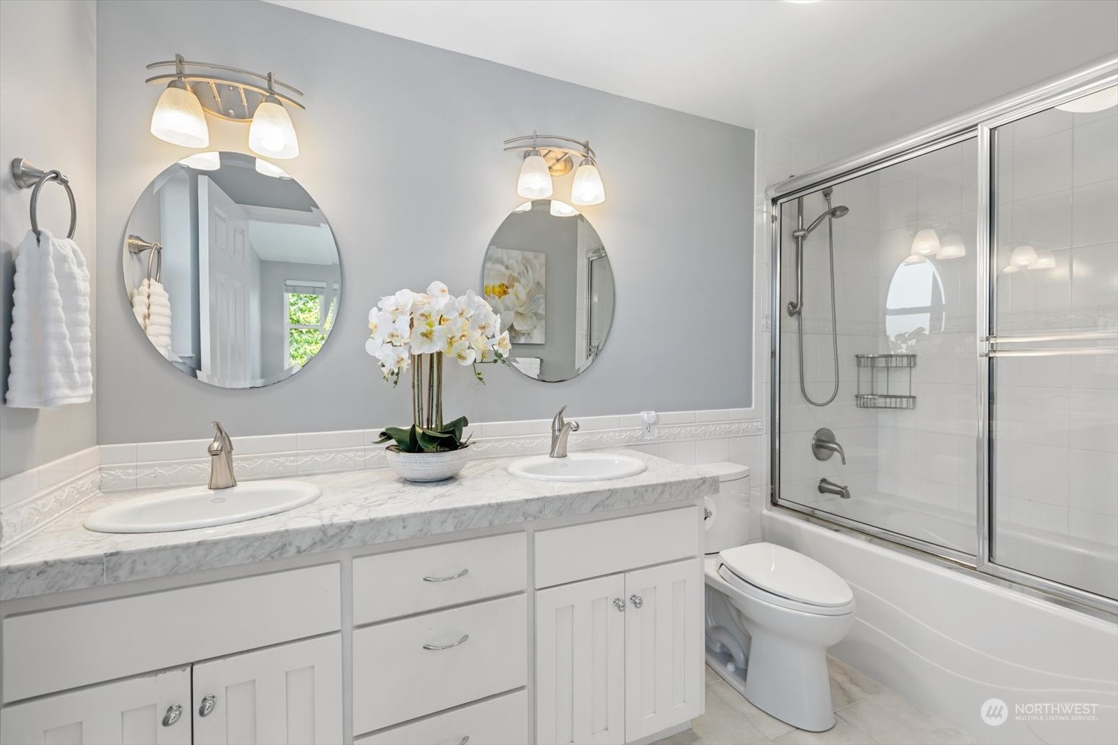 8630 217th Street Southwest Edmonds, WA 98026 - Photo 13 of 34 a bathroom with a toilet a sink and a mirror