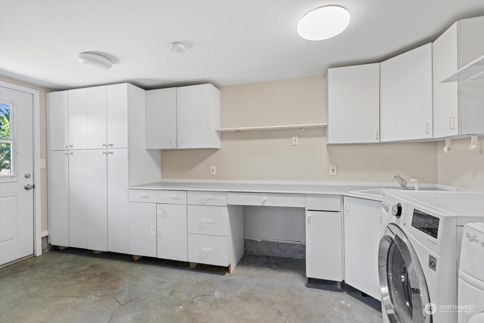 8630 217th Street Southwest Edmonds, WA 98026 - Photo 14 of 34 a room with cabinets and white appliances