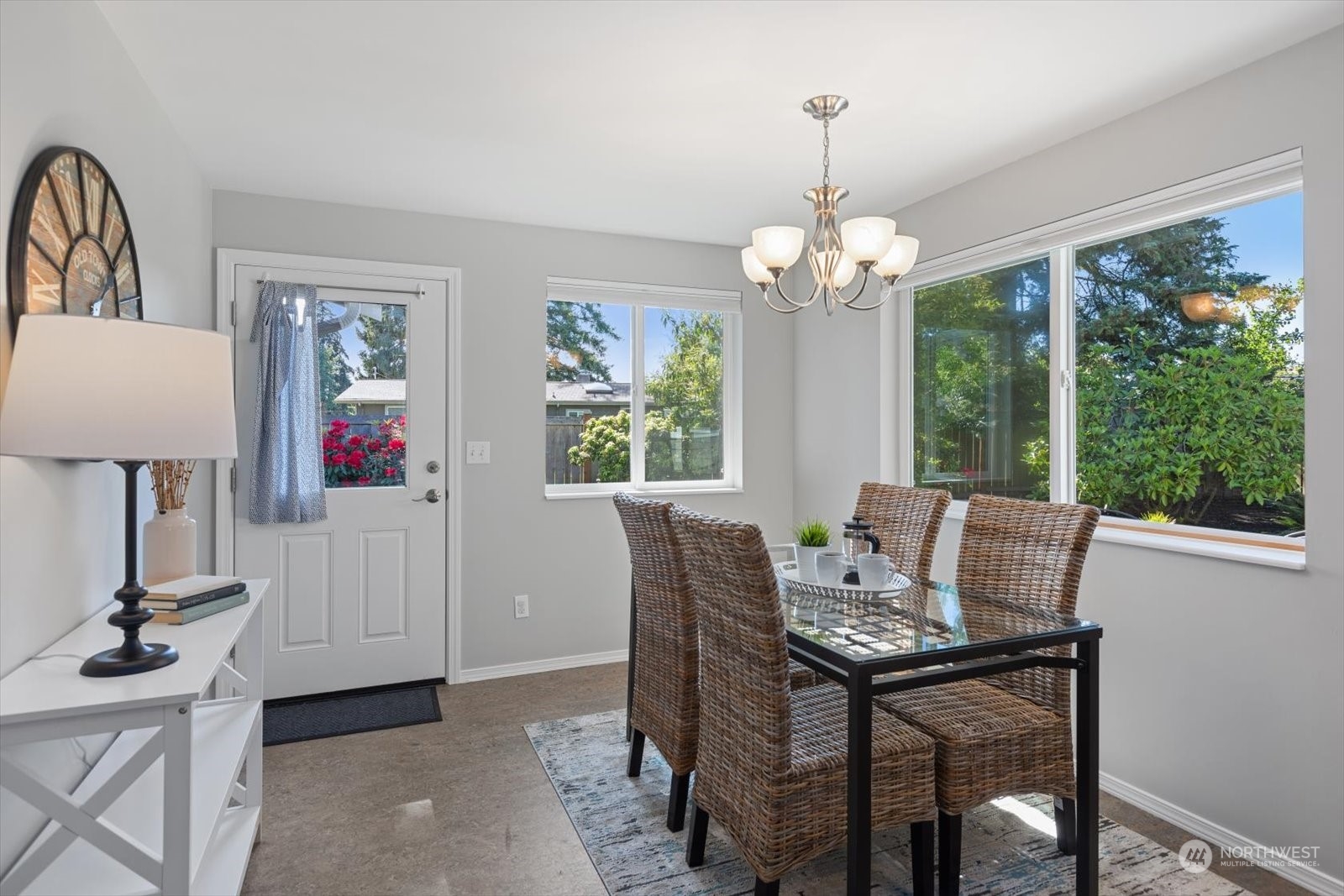 8630 217th Street Southwest Edmonds, WA 98026 - Photo 18 of 34 a view of a dining room with furniture window and outside view